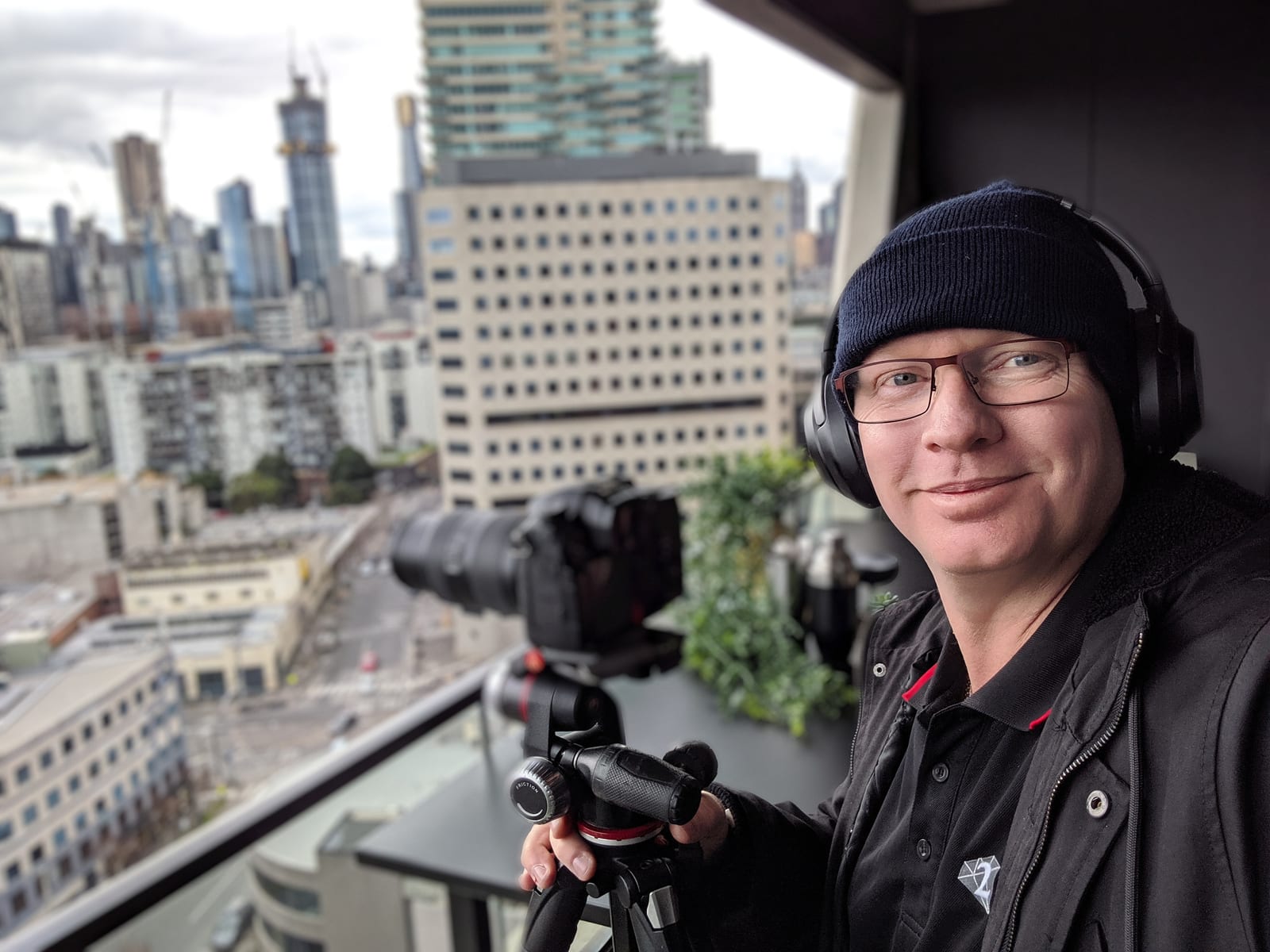 Dave filming from a city location