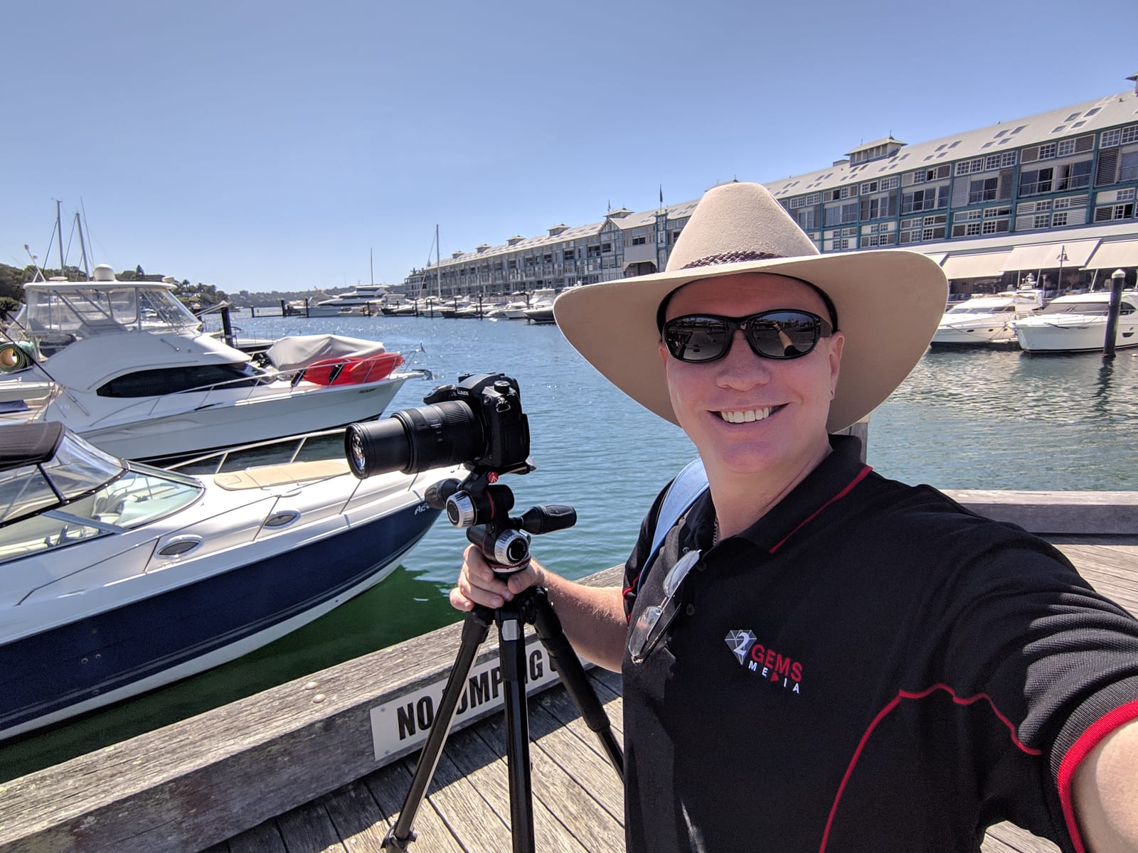 Dave filming at a marina