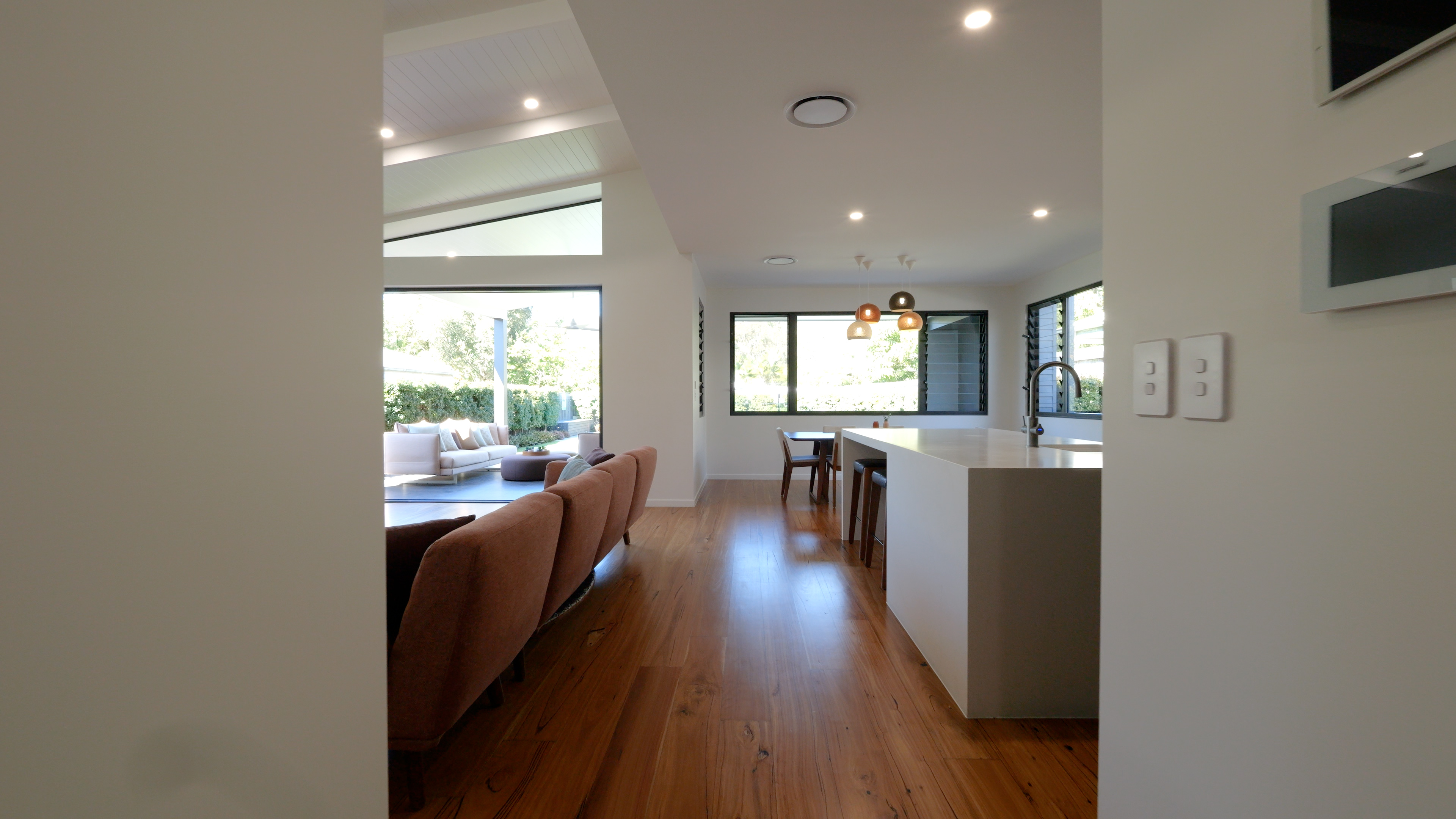 Original lounge video frame with overexposed windows