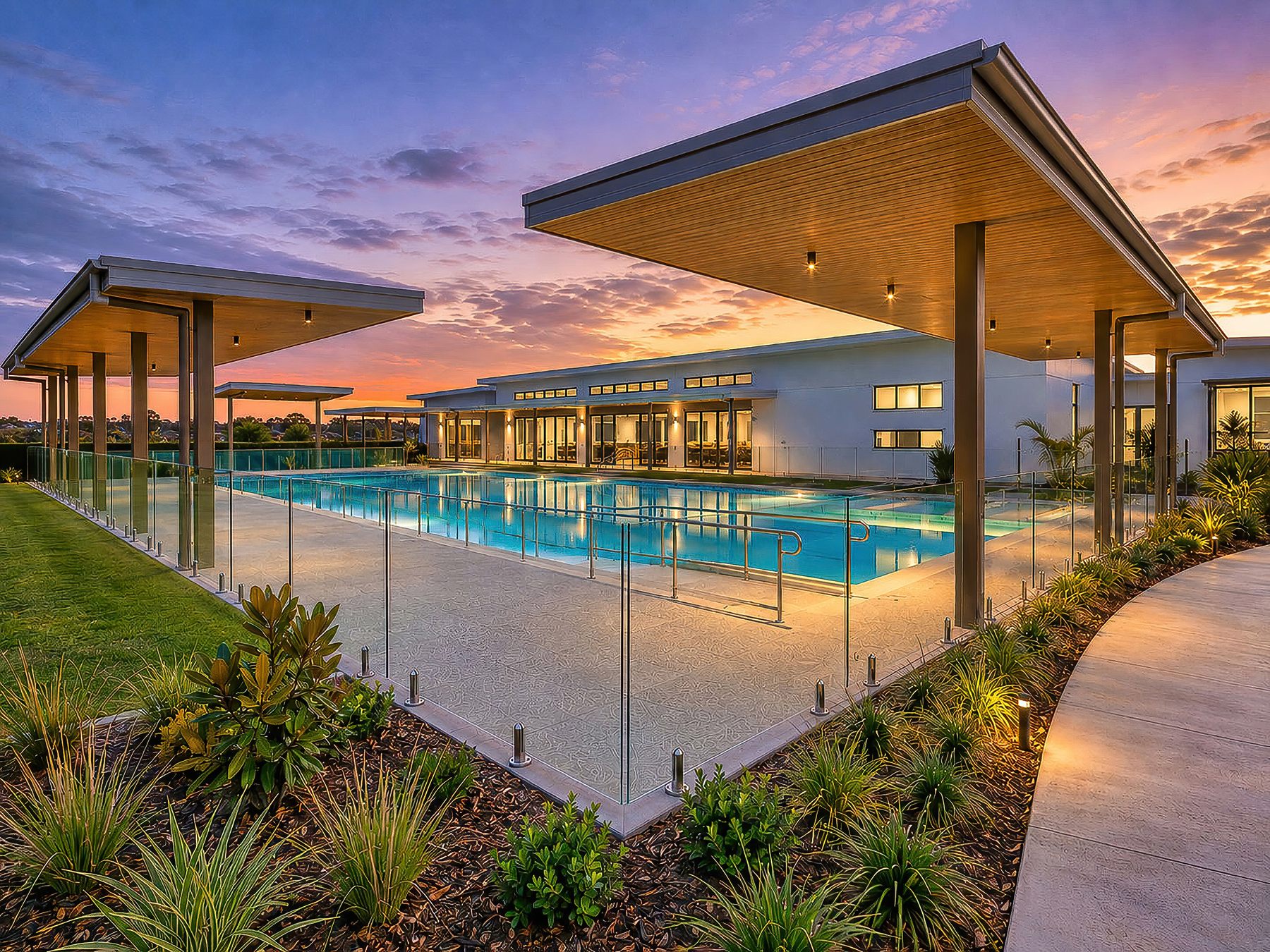 Vantage Hervey Bay Clubhouse pool and architecture at twilight