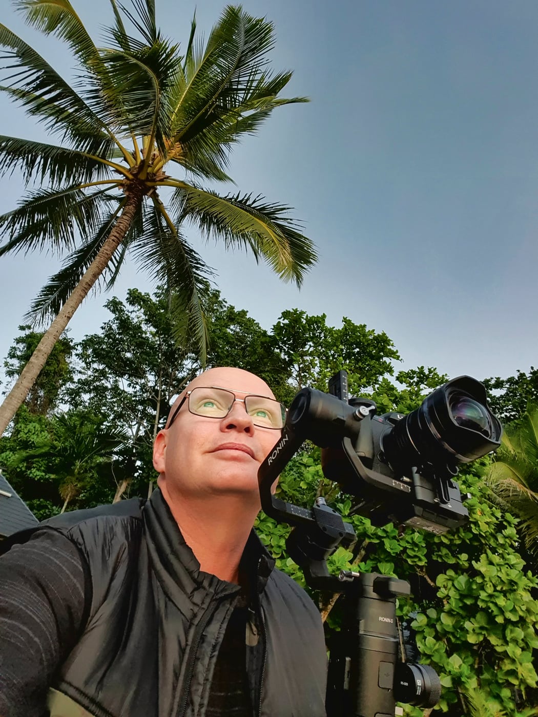 Dave operating a camera on a tropical location